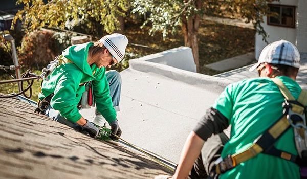 solar-panel-installation-crew-members-on-roof-of-h-2024-11-03-04-48-58-utc.jpg